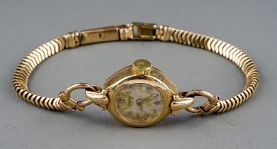 A 9ct yellow gold ladies Rotary wristwatch, circular dial, on a 9ct gold snake-link bracelet