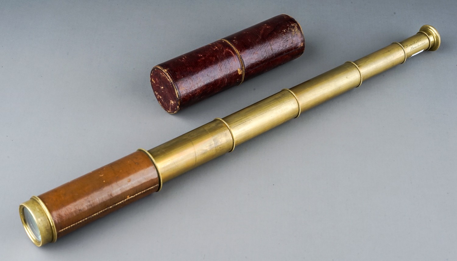 A late 19th Century leather and brass five drawer telescope by Ronchetti Manchester with fitted