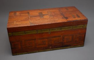An early 20th Century brass and vari wood carrying box, the cover inset with initials H, L and E,
