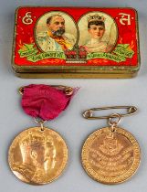 Coronation medal 1902 and newspaper article with tin and another 1902 Coronation medal