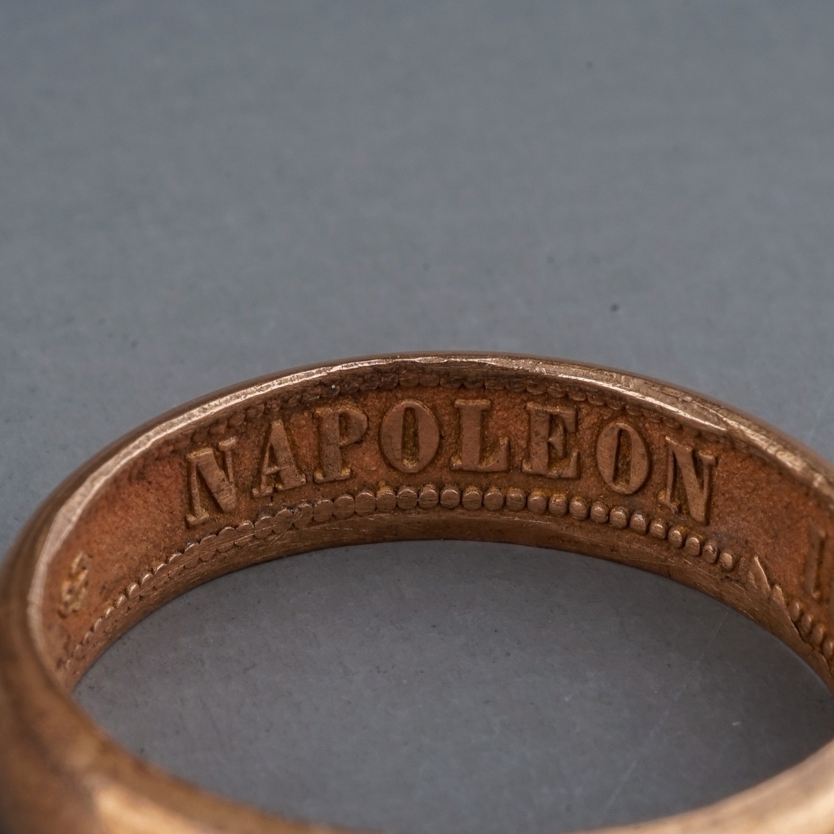 A rose gold ring, of plain design, the inner shank inscribed 'NAPOLEON EMPEREUR III 1861', size R, - Image 2 of 4