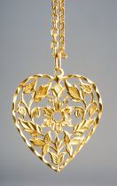 A yellow gold pendant and chain, the chased and pierced heart shape pendant suspended from a