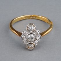 An Edwardian 18ct yellow gold and diamond dress ring, set with old-cut and single-cut stones, size