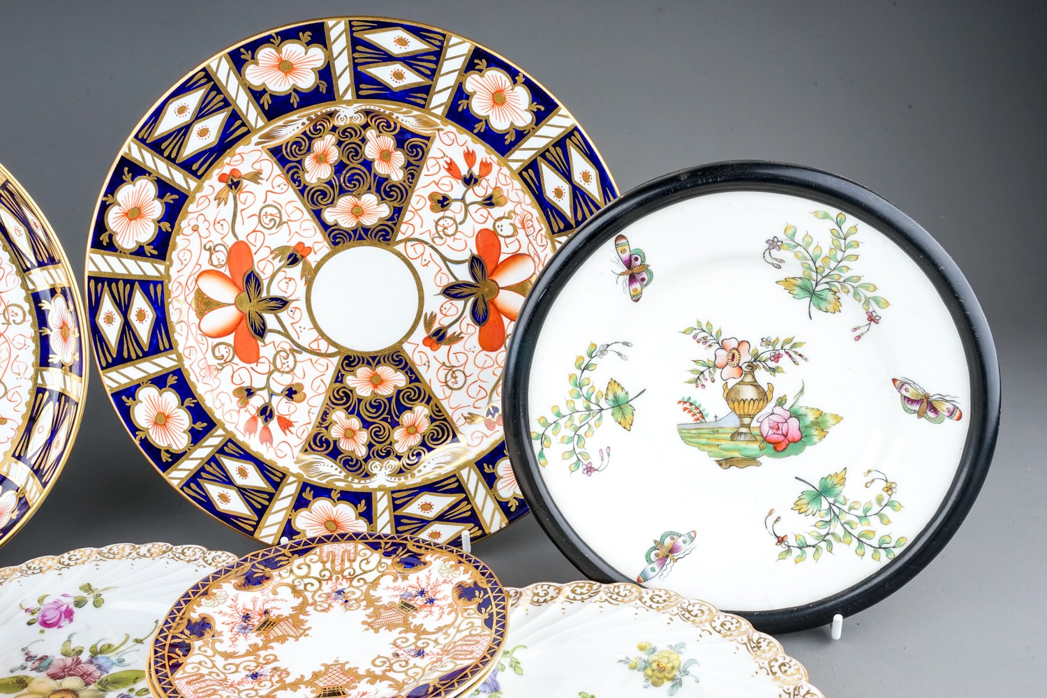 A collection of ceramics to include Dresden porcelain plates, Royal Crown Derby plates, cups, - Image 13 of 20