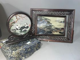 A Chinese silk and embroidered panel of Pandas, signed within circular frame and mount, fitted box