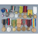 A collection of World Medals. 15 in total, France, Belgium, Pakistan etc. Conditions VF+