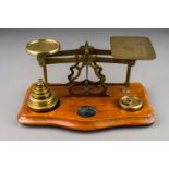 An early 20th Century brass mounted Postal Rate scales for Letters with various weights, approx 23cm