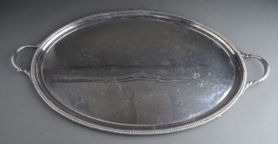 A George VI silver oval two handled tray with gadroon border, plain reserve, approx 85 ozt (2.