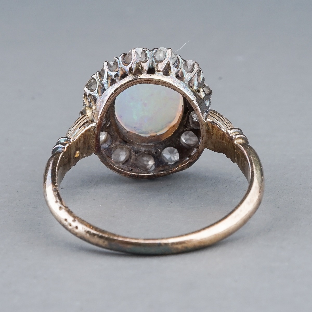 An Edwardian opal and diamond dress ring, set with an oval cabochon precious opal approx 7mm x 8. - Image 6 of 6