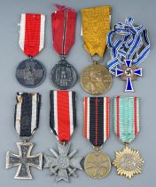 A collection of 8 German Medals. Eastern Front Medal, Mothers Cross in Bronze, War Merit Medal,
