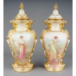 Arthur Leslie: a pair of early 20th Century Royal Doulton vases and covers, urn shaped bodies