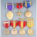 A collection of 7 American Medals. Purple Heart, Air Medal, Bronze Star, Army Good Conduct Medal,