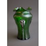 An early 20th Century iridescent green waisted vase with tri-form rim, applied with claw pattern