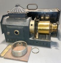 An early 20th Century tinplate magic lantern, in carrying box