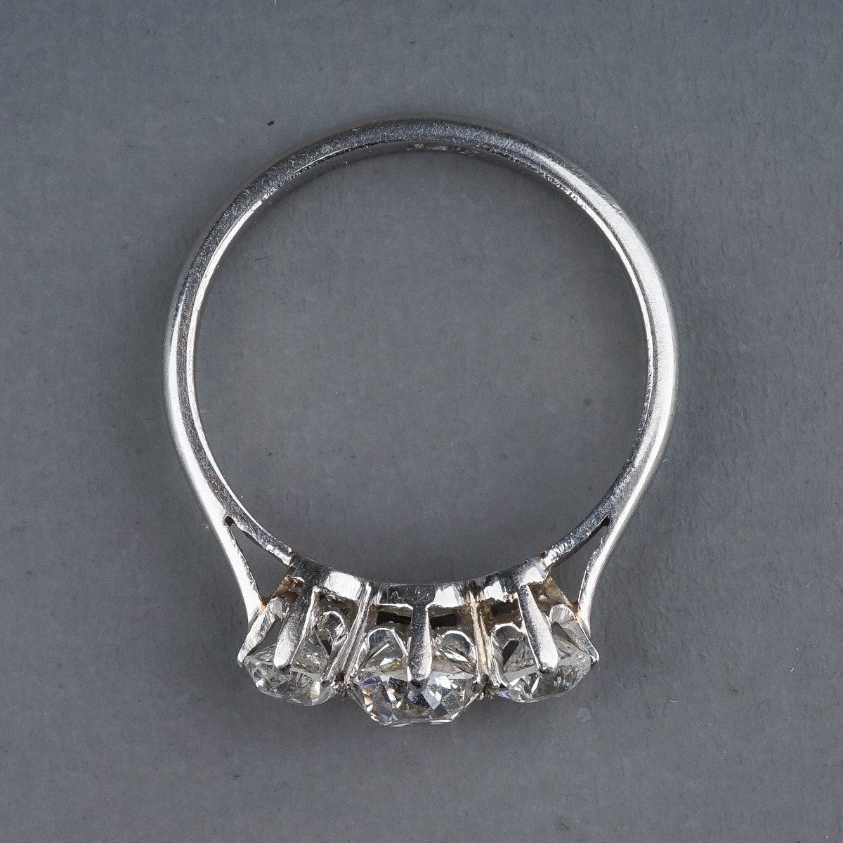 A platinum and diamond three stone ring, set with old-cut diamonds, estimated total diamond weight - Image 3 of 6
