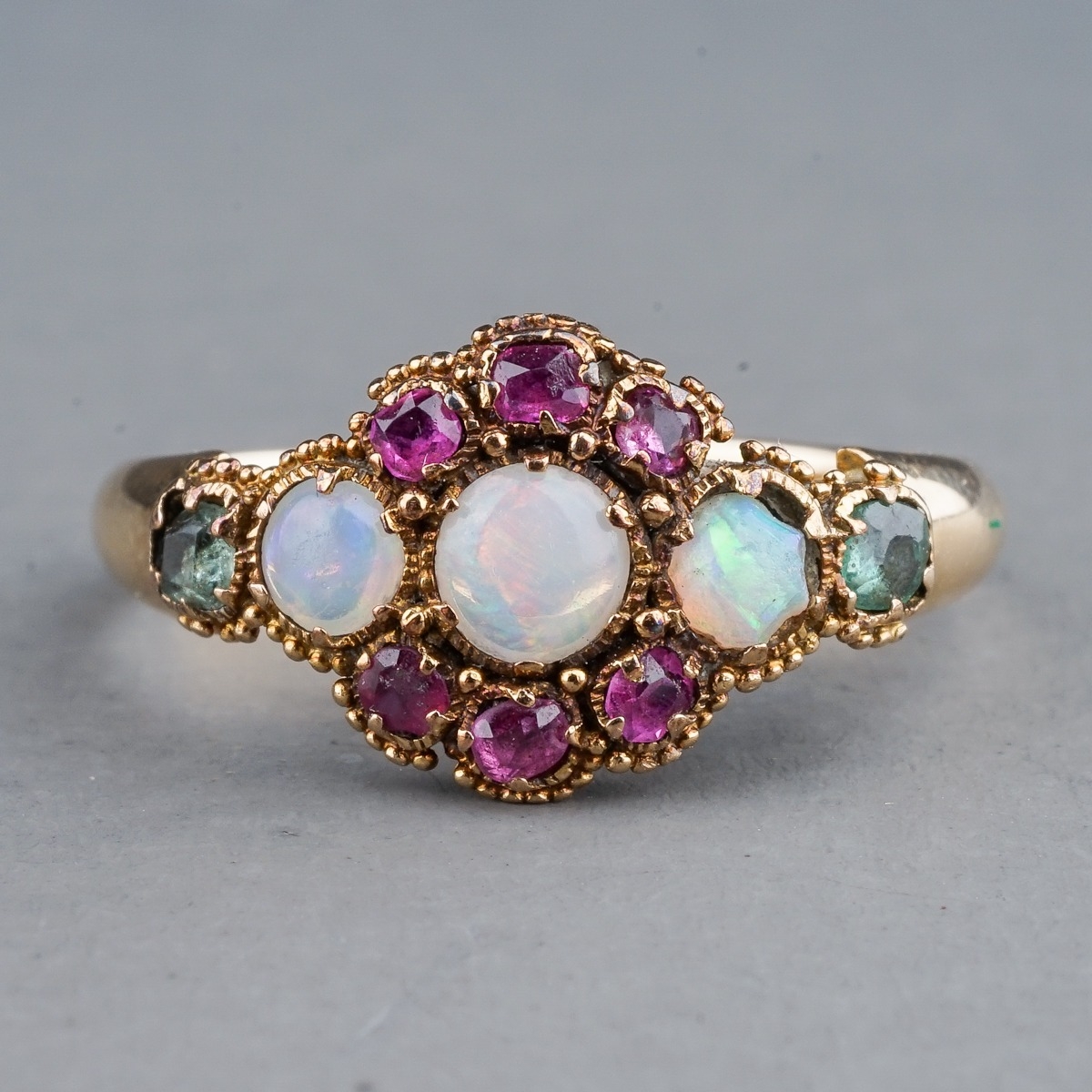 An early 20th century yellow gold opal cluster ring, set with three round cabochon opals within a - Image 2 of 3