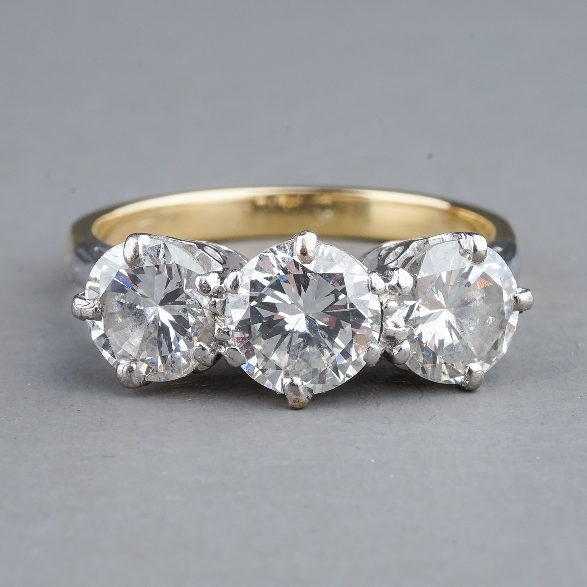 A yellow gold and diamond three-stone ring, set with round brilliant-cut diamonds, centre stone - Image 2 of 6