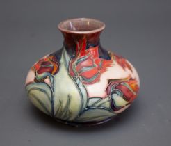A Moorcroft Red Tulip squat vase with WM monogram and printed marks to base, 11cm high.
