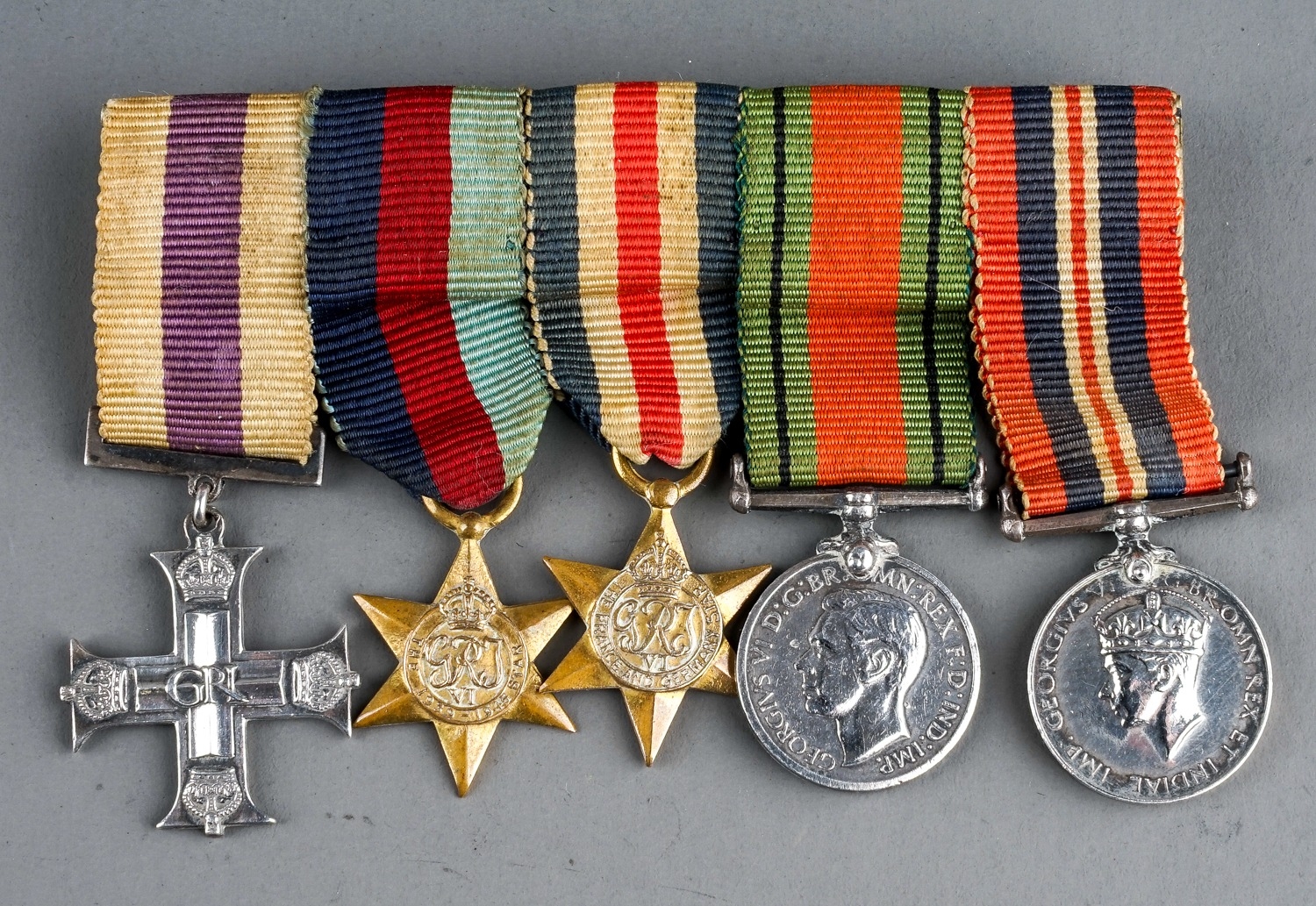 Miniature set of WW2 medals including Military Cross 1935/45 Star, France & Germany star, Defence