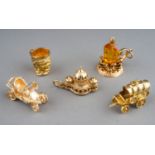 Five 9ct yellow gold charms, including motor car, wagon, Brighton Pavillion, Toby jug and an oil