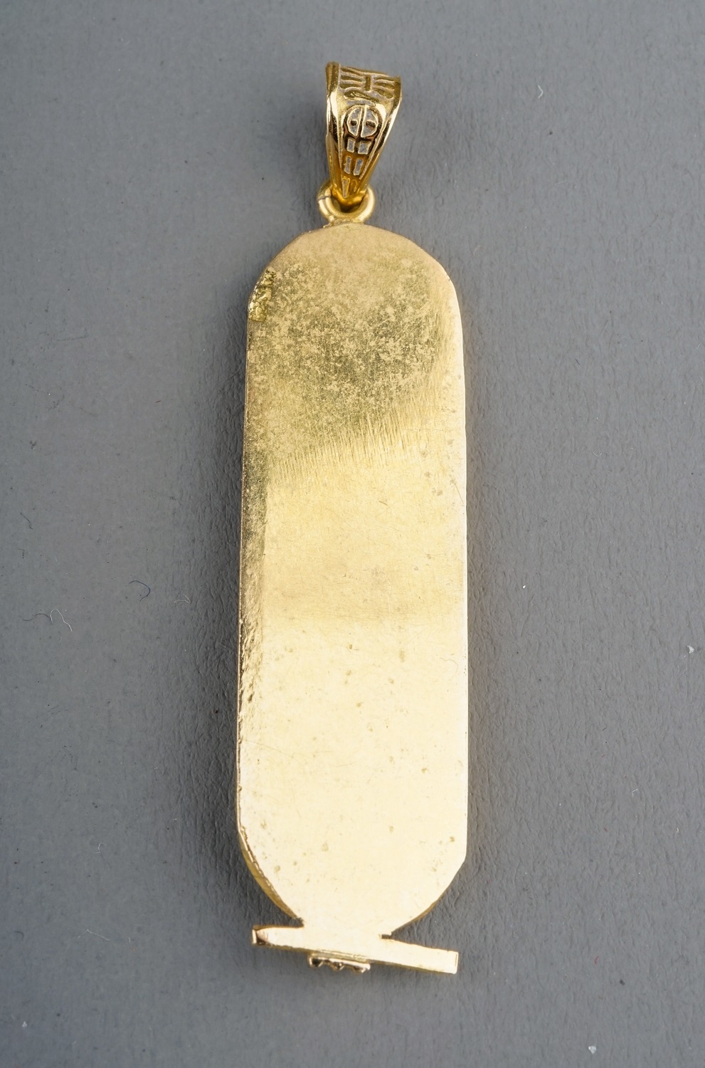 An Egyptian yellow gold pendant, cast with hieroglyphics, control mark to back, approx 5.2cm long, - Image 3 of 6