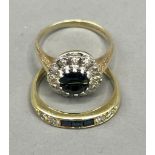An 18ct yellow gold sapphire and diamond ring, set with three calibre-cut diamonds and four round