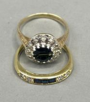 An 18ct yellow gold sapphire and diamond ring, set with three calibre-cut diamonds and four round