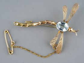 An early 20th century yellow gold and aquamarine dragonfly brooch, set with an oval-cut