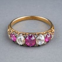 A yellow gold ruby and diamond five-stone ring, set with three graduated rubies and two old-cut