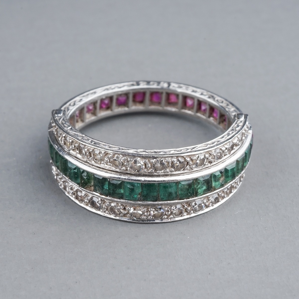 An Art Deco platinum diamond ruby and emerald swivel or flip ring, set with calibre cut rubies and - Image 2 of 6