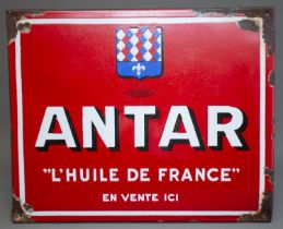 An early 20th century French enamel advertising sign for Antar, with red ground and white lettering,