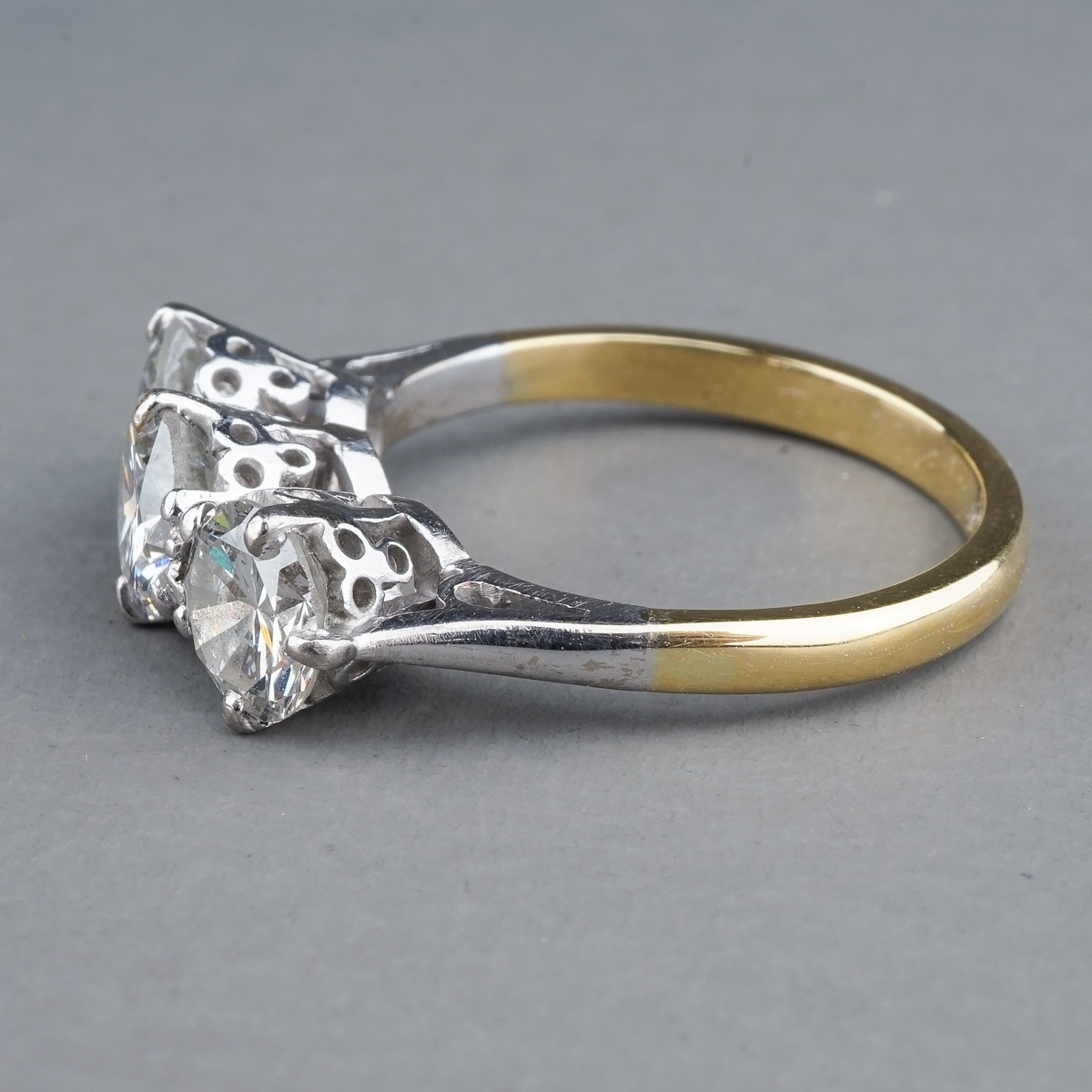 A yellow gold and diamond three-stone ring, set with round brilliant-cut diamonds, centre stone - Image 4 of 6