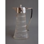 A late Victorian silver mounted cut glass claret jug, tapering oval facet body with cut bands and