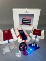 A collection of Swarovski Collectors Society boxed display stands including a SC Chinese Zodiac