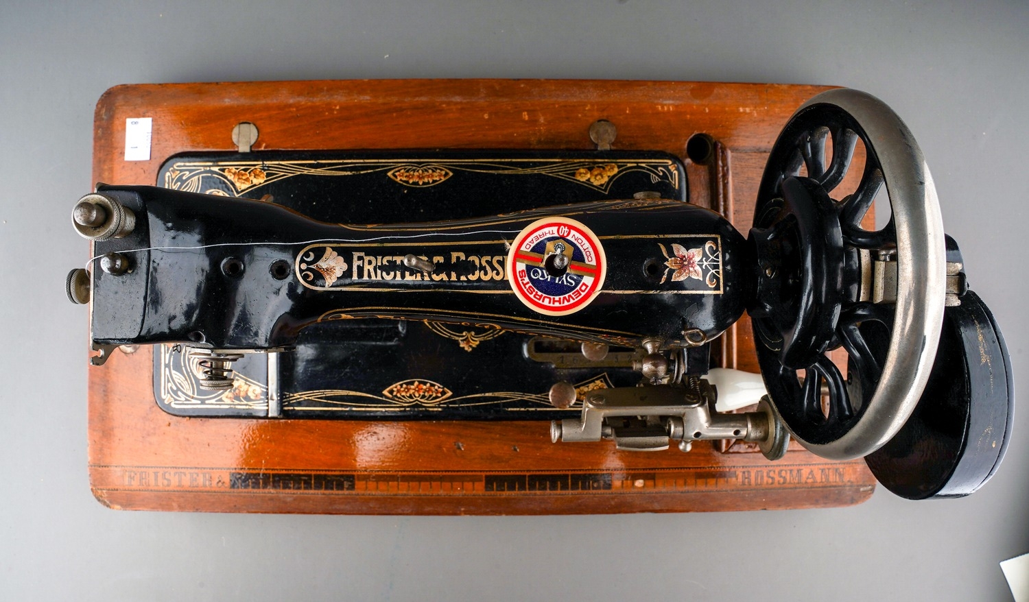 An early 20th Century cased Frister & Rossman black and gilt cranked sewing machine, the stand - Image 3 of 7