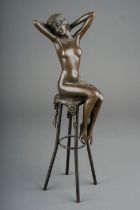In the manner of Chiparus, a modern bronze of a seated female nude, approx 27cm high