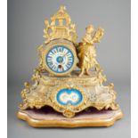 A French gilt spelter porcelain mounted mantle clock, the drum movement with Sevres style dial Roman