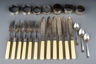 A collection of seven various 20th Century silver napkin rings and spoons, various dates and makers,