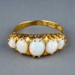 A Victorian 18ct yellow gold and opal five-stone ring, set with five graduated oval cabochon