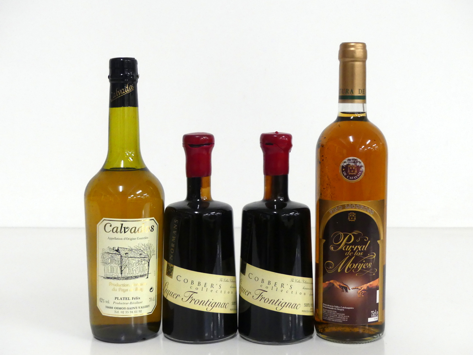 1 70-cl bt Platel Félix Calvados ts 2 50-cl bts Normans Cobber's Collection Liqueur Frontignac