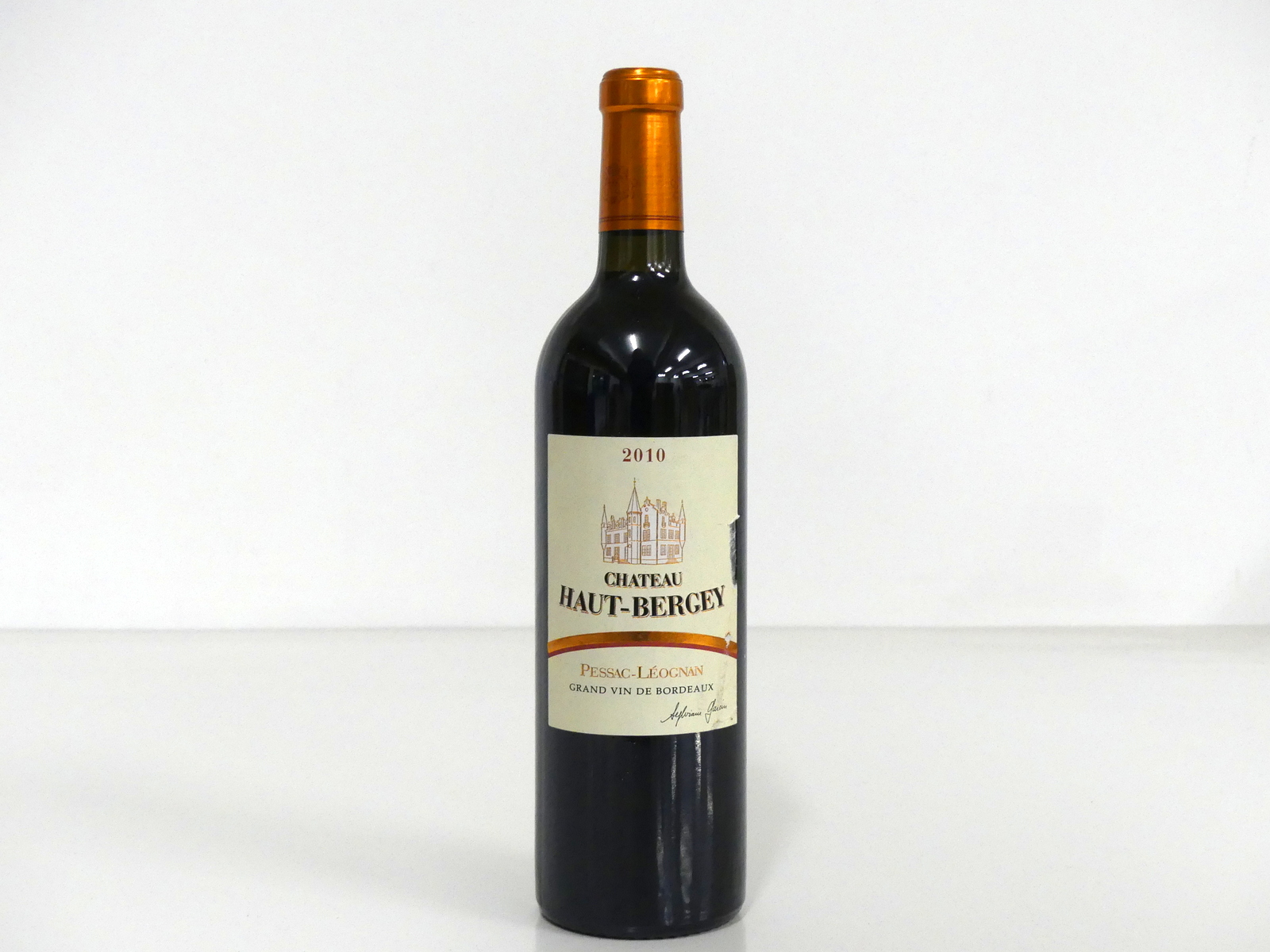 1 bt Ch. Haut-Bergey 2010 Pessac-Léognan Cru Classé i.n, sl scuffed label