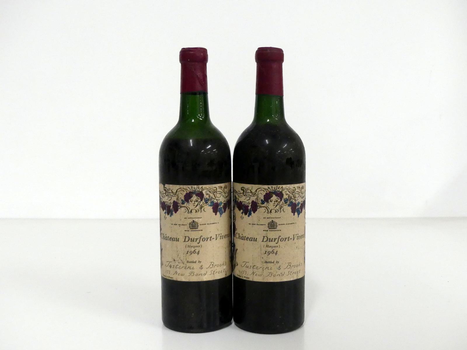 2 bts Ch. Durfort-Vivens 1964 EB Margaux, 2me Cru Classé, ts, lms, sl bs, Justerini & Brooks