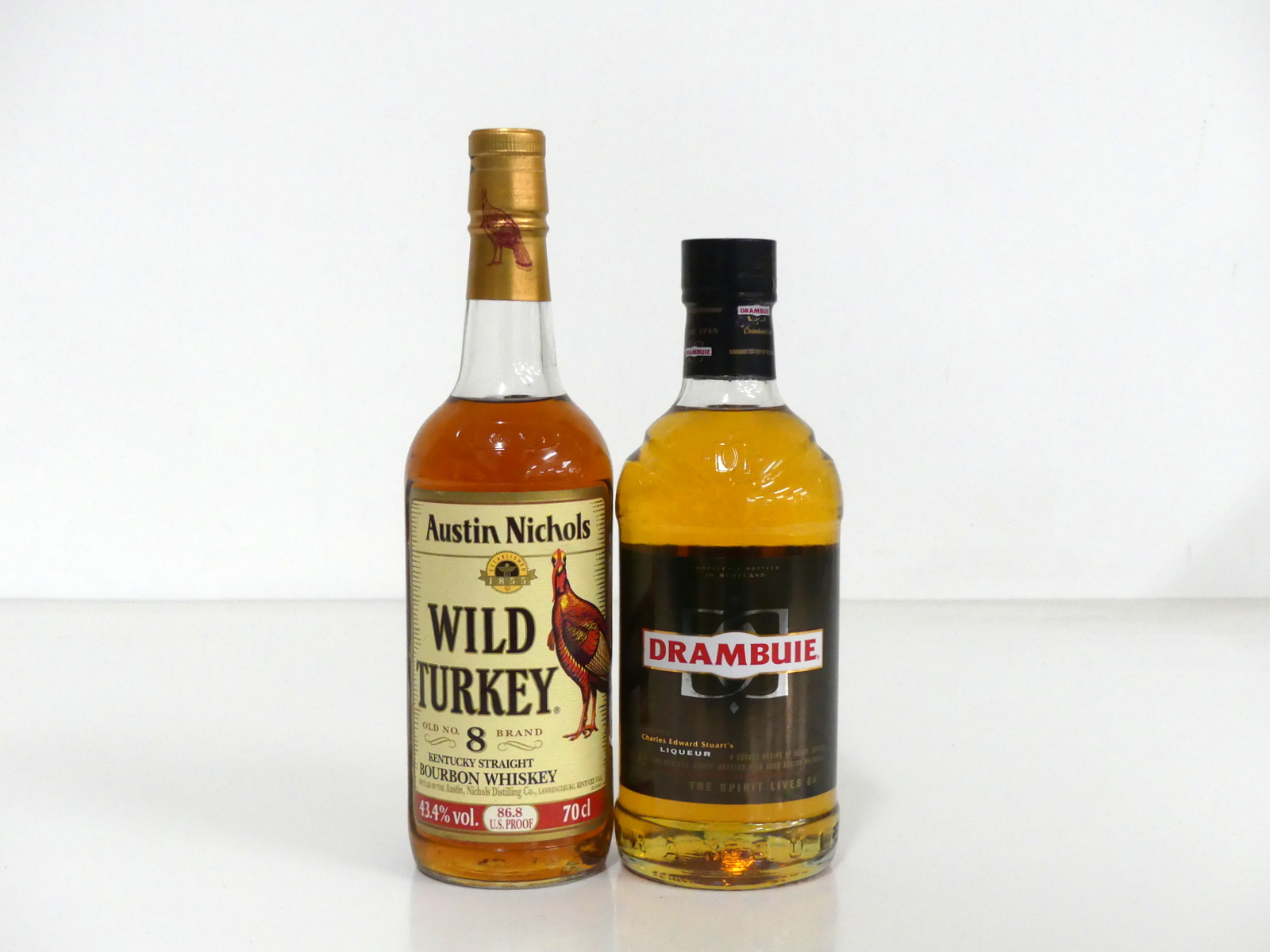 1 70-cl bt Wild Turkey Bourbon 43.4% 1 70-cl bt Drambuie 40% Above 2 70-cl bottles