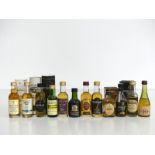 12 5-cl bts Whisky miniatures incl: Macallan 10 YO, Bowmore 10 YO & The Antiquary