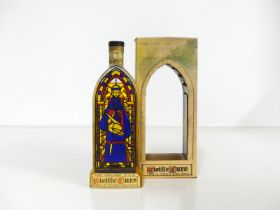 1 20¾ fl oz bt Vieille Cure Liqueur de L'Abbaye 75° proof stained glass-style bottle, circa 1970's