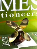 A Handmade Desk Top Brass Propeller On Wooden Display Stand