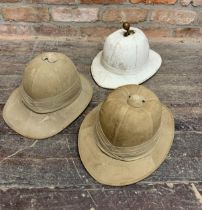 Three vintage pith helmets