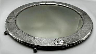 Silver plate and mother of pearl circular mirror inset with mother of pearl panels and embossed '