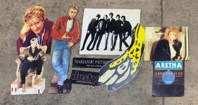 Collection of film and music related advertising material to include cardboard cut outs and posters