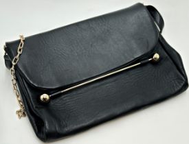 Black leather envelope clutch bag by Rupert Sanderson. Featuring magnetic flap closure, gold-tone